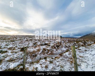 The snow covered Mount Errigal, the highest mountain in Donegal - Ireland Stock Photo