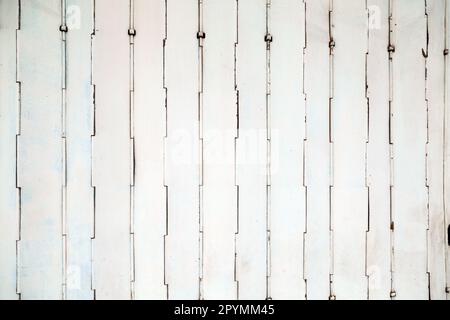 White color old metal folding gate background. Geometric pattern on a closed Asian shop door Stock Photo