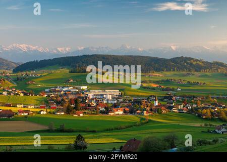 view of Biglen towards the alps in Emmental during sunset Stock Photo