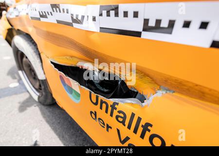 04 May 2023, North Rhine-Westphalia, Münster: After the crash test for the research project Accident risk with tractors and agricultural machinery, the car is severely deformed, with a large crack in the driver's door. Tractors and other agricultural machinery and their attachments have become increasingly large in recent years, sometimes filling the entire width of the carriageway on narrow country roads. In a research project, the Insurers Accident Research has determined the way in which this affects road safety. Photo: Christoph Reichwein/dpa Stock Photo