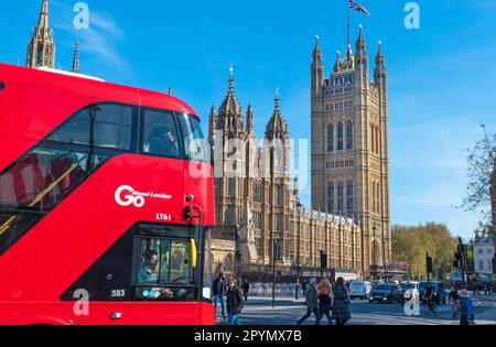 London UK May 3 2023 Iconic London  Red Bus and the Houses of Parliament  in view . The building has been cleaned and gilted  ahead of the Royal processions' route for the Coronation of King Charles III and Queen Camilla on 6 May. . Credit Gary Blake / Alamy live news Stock Photo