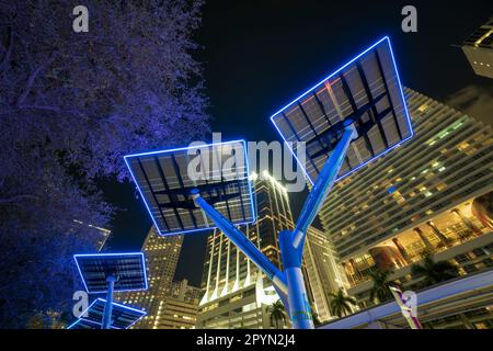 Blue solar photovoltaic panels mounted in modern city on street poles for electricity supply of streetlights and surveillance cameras. Futuristic ener Stock Photo