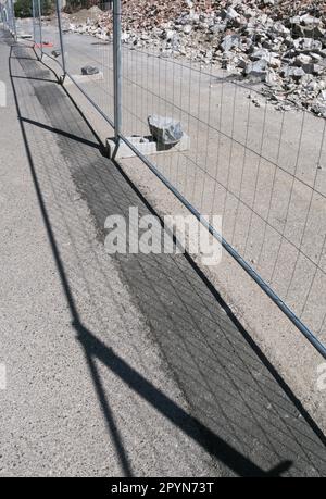 debris and metal fence on a construction site Stock Photo