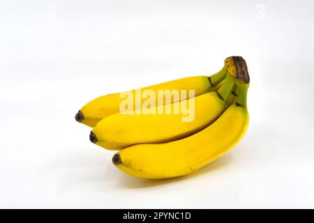 Bunch of fresh ripe bananas isolated on a plain white background. Copy space. Stock Photo