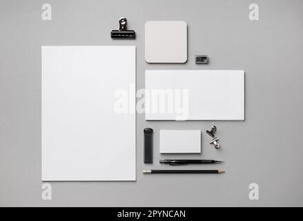 Blank corporate identity template. Photo of blank stationery set on gray paper background. Flat lay. Stock Photo