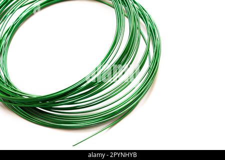 Large coil of wire on the table close up Stock Photo