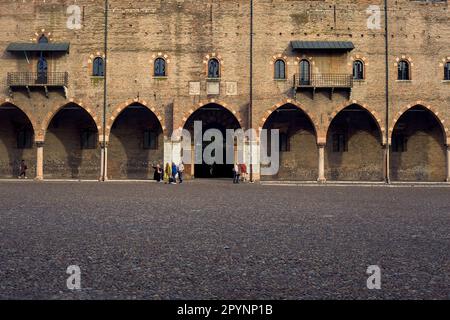 Facade  with porch of a palace in a cobbled square at dusk in an italian town Stock Photo