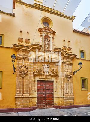 The carved stone facade of historic Las Esclavas del Sagrado Corazon Church, located on Calle Luna, El Puerto, Spain Stock Photo