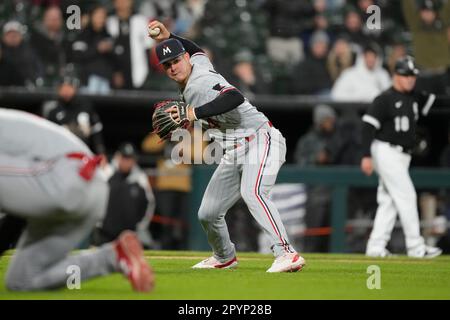 Minnesota Twins third baseman Jose Miranda throws to first base