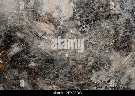 Grunge old black metal background or texture with scratches and cracks, close up, top view Stock Photo