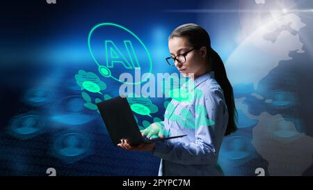 Young teenage female using laptop, ai, chatbot assistant Stock Photo