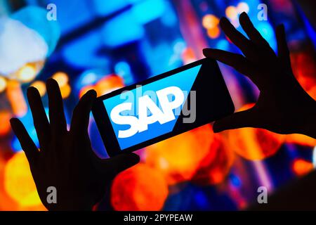 In this photo illustration, the SAP SE logo is displayed on a smartphone screen. Stock Photo