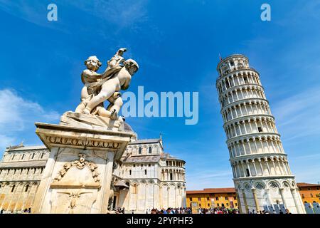 Pisa Tuscany Italy. Piazza dei Miracoli (Square of Miracles). The Leaning Tower and fontana dei putti (fountain of the angels) Stock Photo