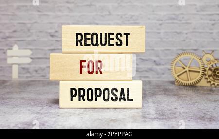 Closeup on businessman holding a wooden block with Request for proposal, Business concept Stock Photo