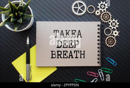 text Takea deep breath on noteboock Stock Photo