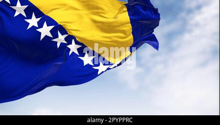 Flag of Bosnia and Herzegovina waving in the wind. Blue field with yellow triangle and white stars. 3d illustration render. Fluttering textile Stock Photo