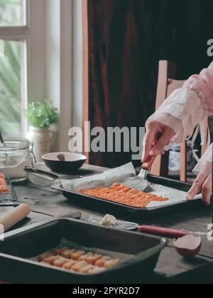 the making process of kaastangel, cheesy cookies. one of favourite cookies in lebaran or ied al fitr or islamic festive or celebration. made with edam Stock Photo