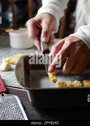 the making process of kaastangel, cheesy cookies. one of favourite cookies in lebaran or ied al fitr or islamic festive or celebration. made with edam Stock Photo