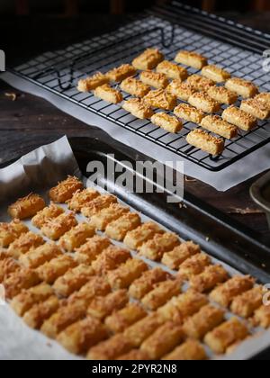 the making process of kaastangel, cheesy cookies. one of favourite cookies in lebaran or ied al fitr or islamic festive or celebration. made with edam Stock Photo