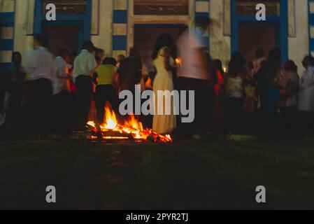 Valenca, Bahia, Brazil - April 08, 2023: Low-speed photography shows worshipers entering the Matriz church on Hallelujah Saturday night in Valenca, Ba Stock Photo