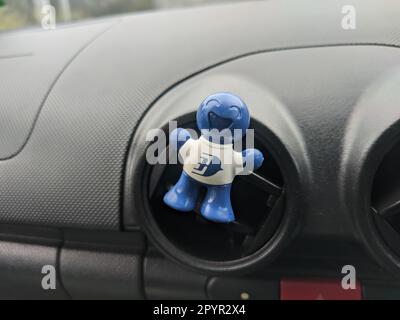 Malaysia, 17 May 2022: Car deodorant affixed to car air conditioner. Stock Photo