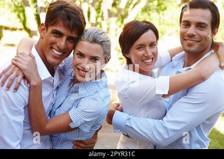 Couples retreat. two happy young couples standing together outside. Stock Photo