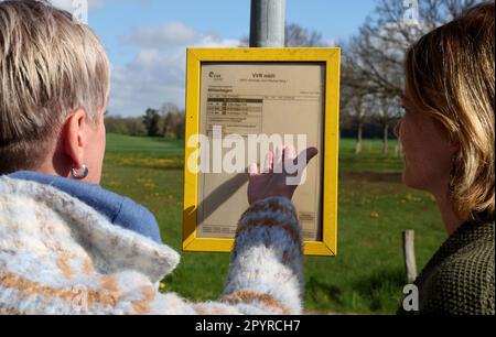 Millienhagen, Germany. 03rd May, 2023. Diana Nurkewitz (l-r) and Maria S. Kasten stand at the local bus stop where the children get on every morning at 6:12 a.m. and get off at 4:40 p.m. who have to go to the high school in Grimmen. The timetable for the school bus feeder to Grimmen is not available at all. The children are on the bus for three hours every day. The mothers are fighting in a parents' initiative for shorter commute times. Credit: Bernd Wüstneck/dpa/Alamy Live News Stock Photo
