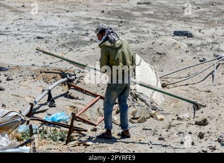 Gaza, Palestine. 03rd May, 2023. A Palestinian inspects the damage caused by Israeli air strikes in Deir al-Balah, central Gaza Strip. Credit: SOPA Images Limited/Alamy Live News Stock Photo