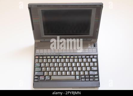 floppy disks and old laptop on a white background Stock Photo