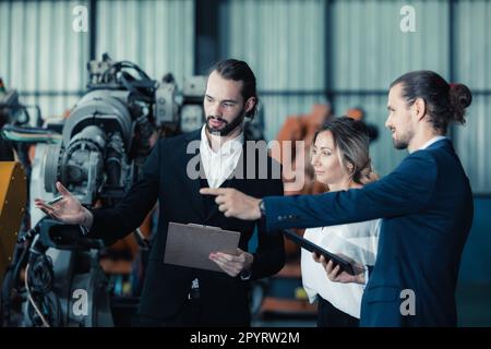 Robotic factory owner explain, discuss functionality and performance of robot systems with client. Answering questions about after-sales service. Pric Stock Photo