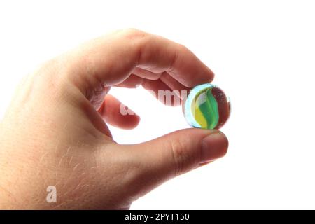 color glass sphere in the human hand isolated on the white background Stock Photo
