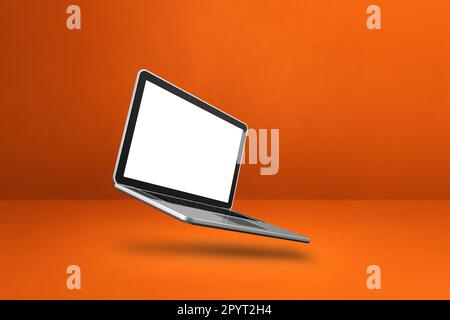 Blank computer laptop floating over an orange background. 3D isolated illustration. Horizontal template Stock Photo