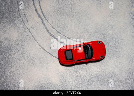 Gothenburg, Sweden - november 27 2022: Top view of a red Porsche 911 model car in snow Stock Photo