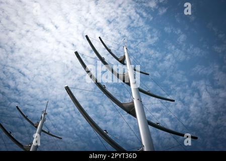 Masts like herringbone and Radar Communication Tower on a Yacht. Detail of luxury white yacht with security camera and navigation equipment, radar and Stock Photo