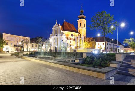 Hungary, Church in square in city Gyor at night Stock Photo