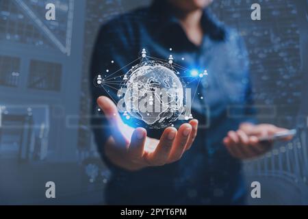 Big data analytics and business intelligence concept. Business person holding Global network connection. World map point and line composition of globa Stock Photo