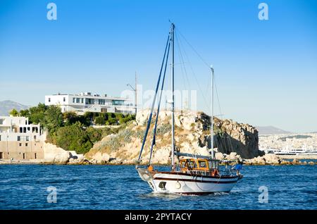 Tradinional wooden cruise boat near coastline Stock Photo
