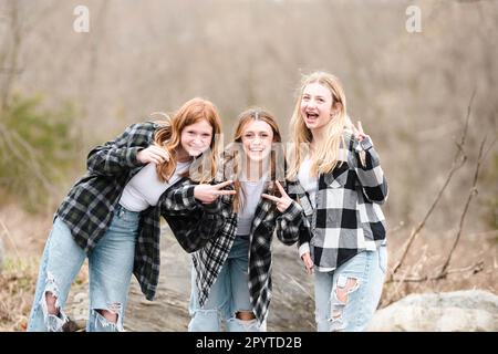 Three beautiful teen girls having fun outdoors. Stock Photo