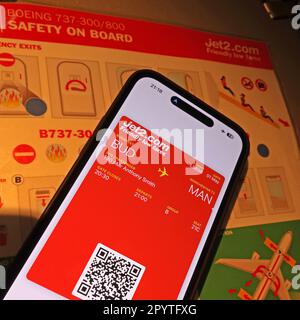 Jet2 digital boarding pass app on an iphone, BUD-MAN, Budapest to Manchester flight - safety on-board sheet Stock Photo