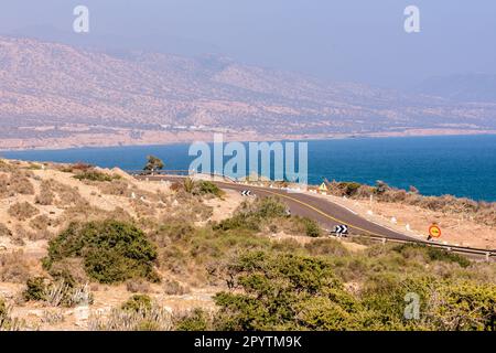 A road along the coast of the Atlantic Ocean in Morocco Stock Photo