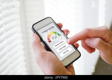 credit score concept on the screen of smart phone, checking payment history and ranking in bank online Stock Photo