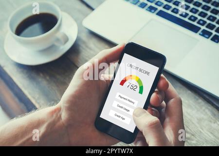 credit score concept on the screen of smart phone, checking payment history in bank Stock Photo