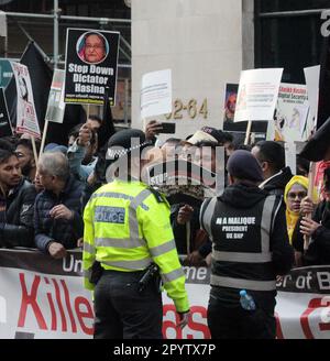 Bangladesh people were outside claridge’s demonstrating some for the prime minister and some agains the prime minister hasina . There was a lot of police there and the demo was still going until 1am.she is in London for the coronation and she is staying at claridge’s with other leaders and kings and queens 4/5/2023 blitz Stock Photo