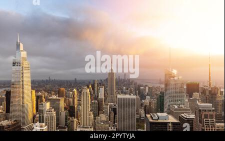 Manhattan skyline in New York, showcasing the impressive architecture and modern cityscape at sunset Stock Photo