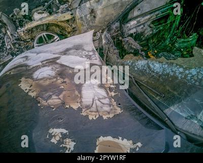 Burnt new car. burnt metal texture, metallic background. Stock Photo