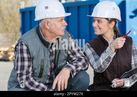 workers having a conversation outdoor Stock Photo