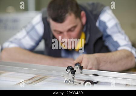 worker leaning on the floor at construction site Stock Photo