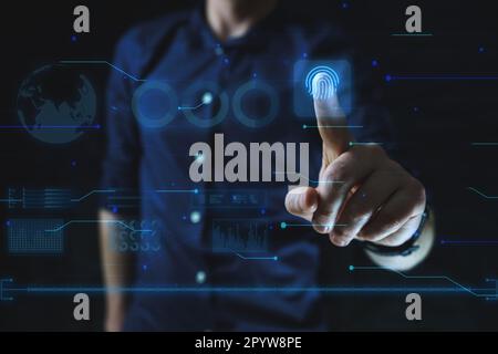 Cyber security technology concept. Man points finger at finger print scan. High quality photo Stock Photo