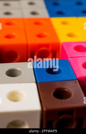 A close-up image of a pile of multicolored cubes for children to assemble Stock Photo
