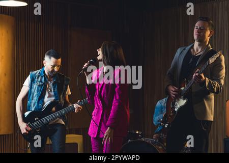Rock band rehearsal in the studio. High quality photo Stock Photo